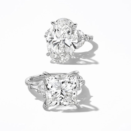 Two silver banded, lab-grown diamond rings by Monique Lhuillier Bliss.